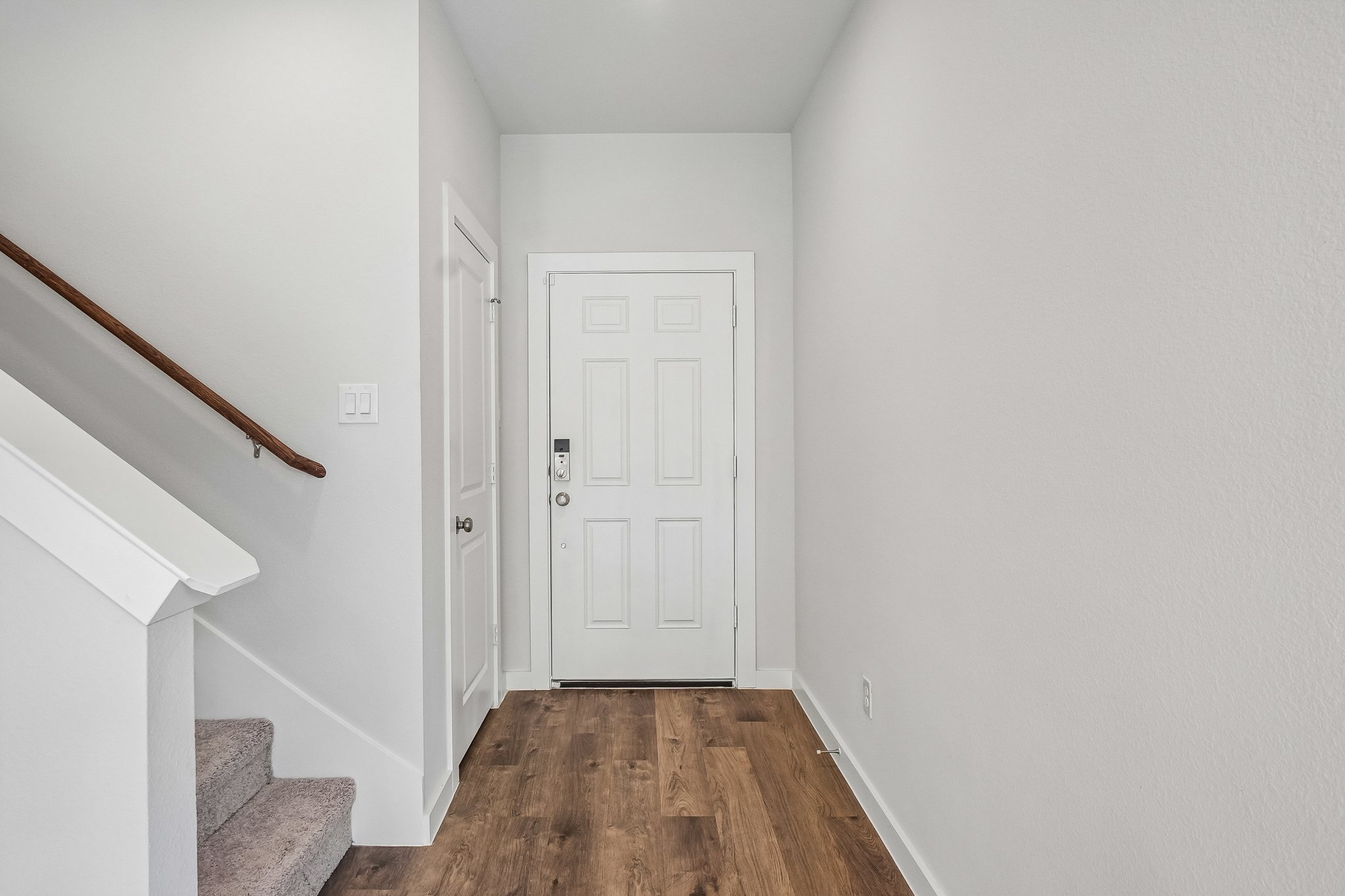 A hallway with white doors.