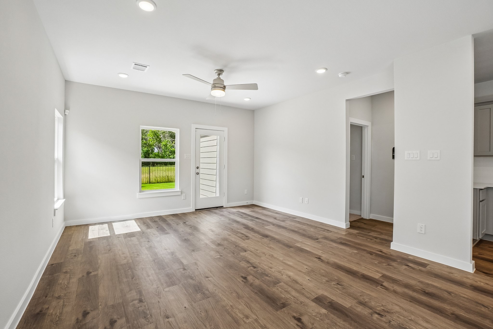 A room with a wood floor and a wood floor.