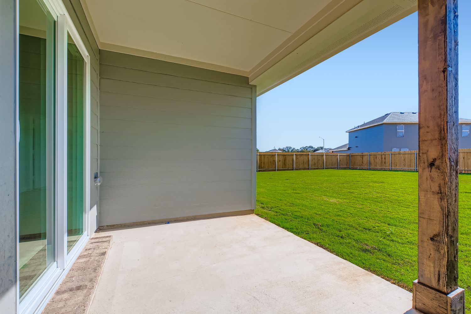 A house with a fence and grass.