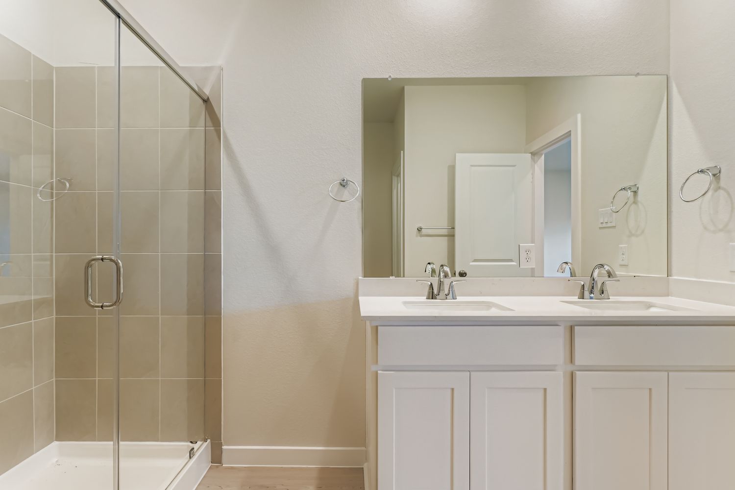 A bathroom with a glass shower.