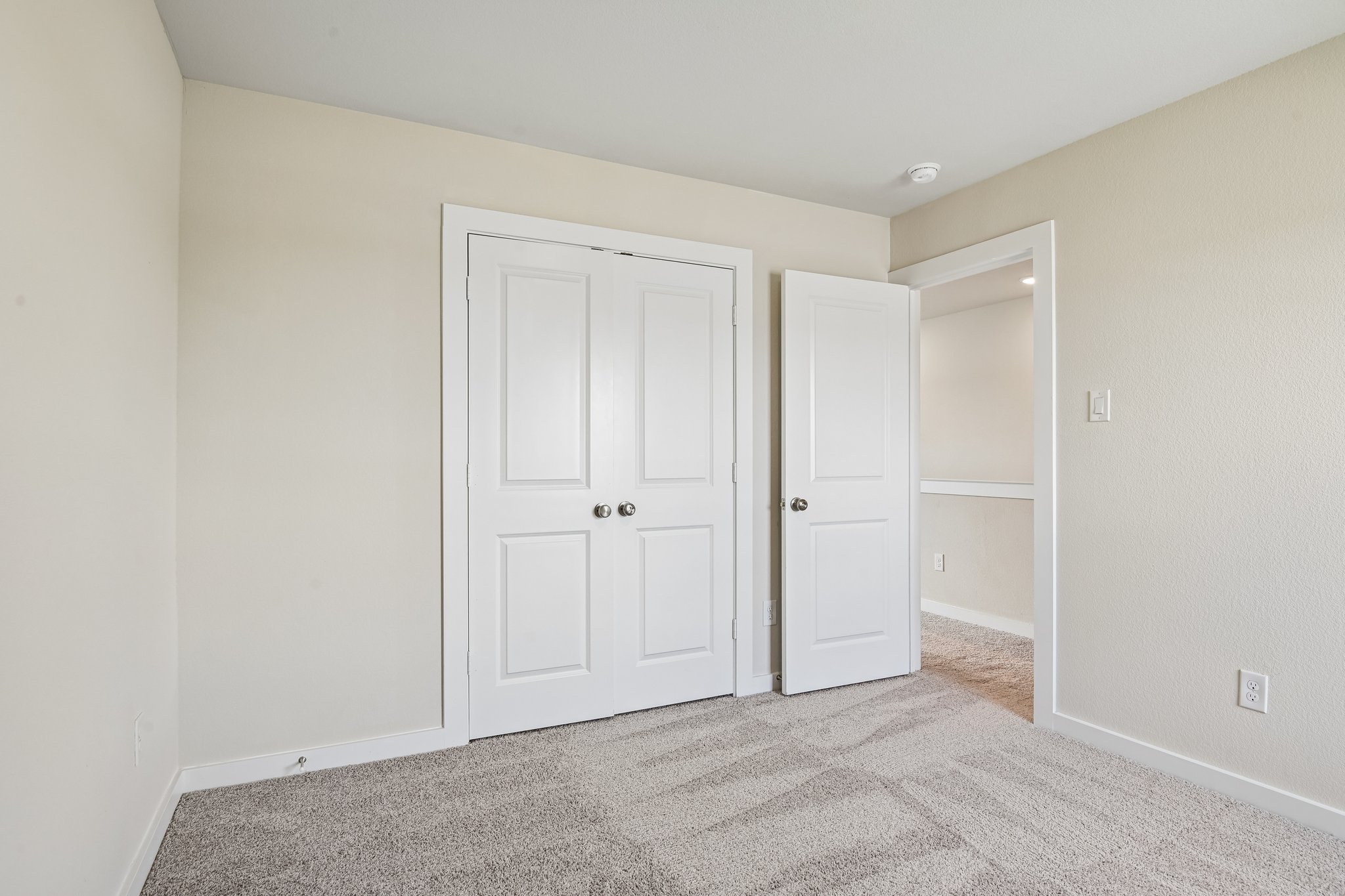 A room with white doors.