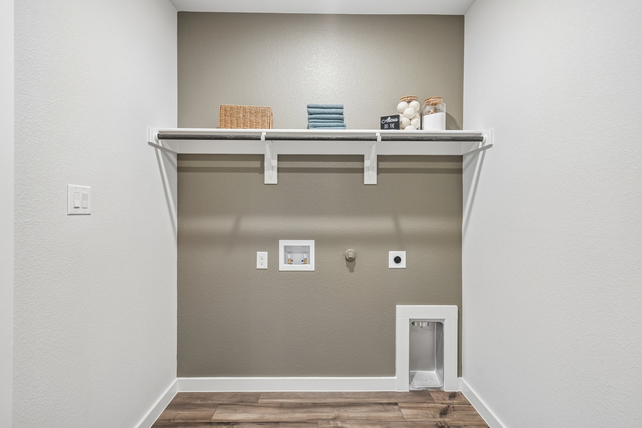 A white shelf with objects on it.
