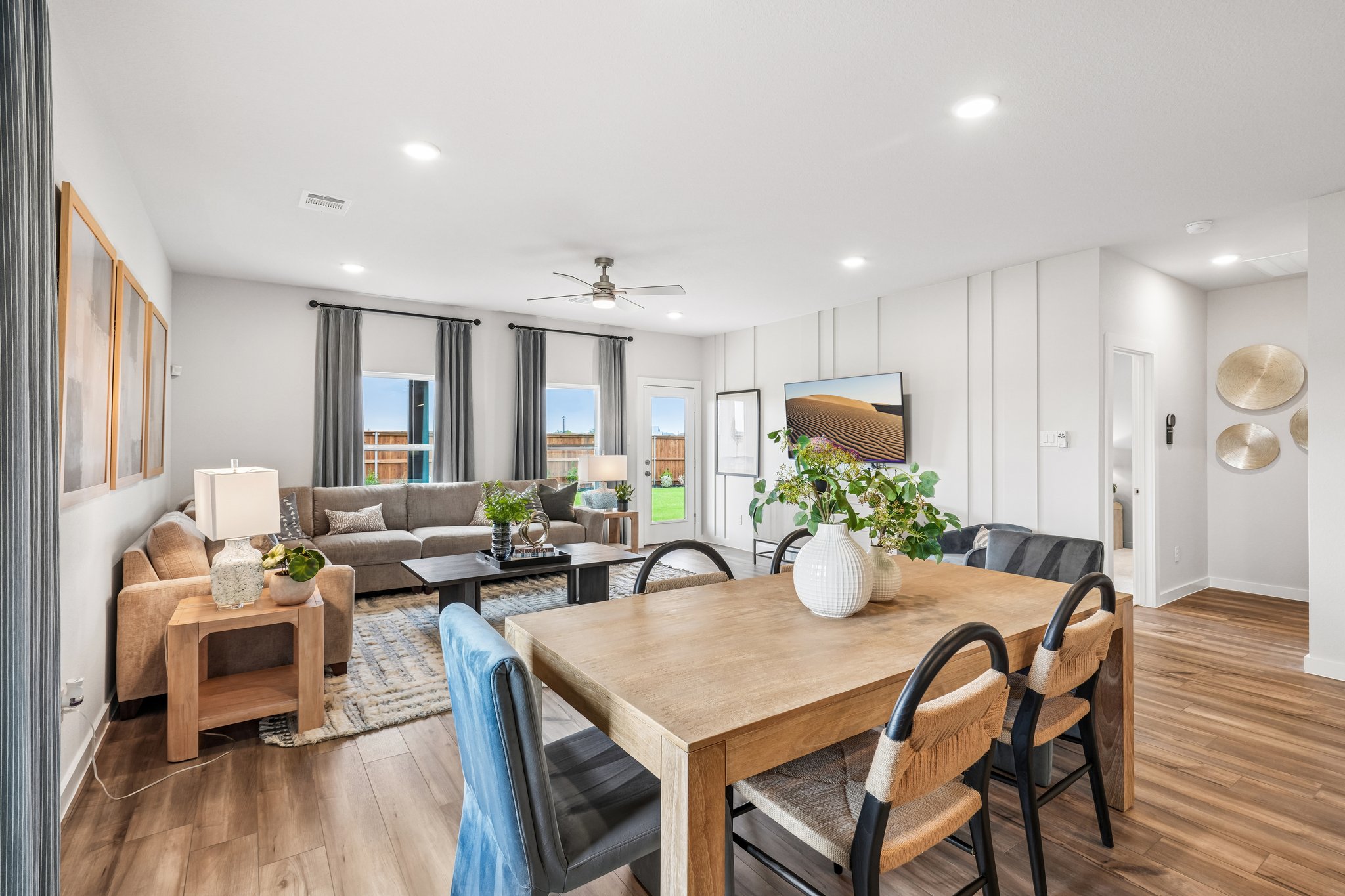 A large living room with a dining table and chairs.