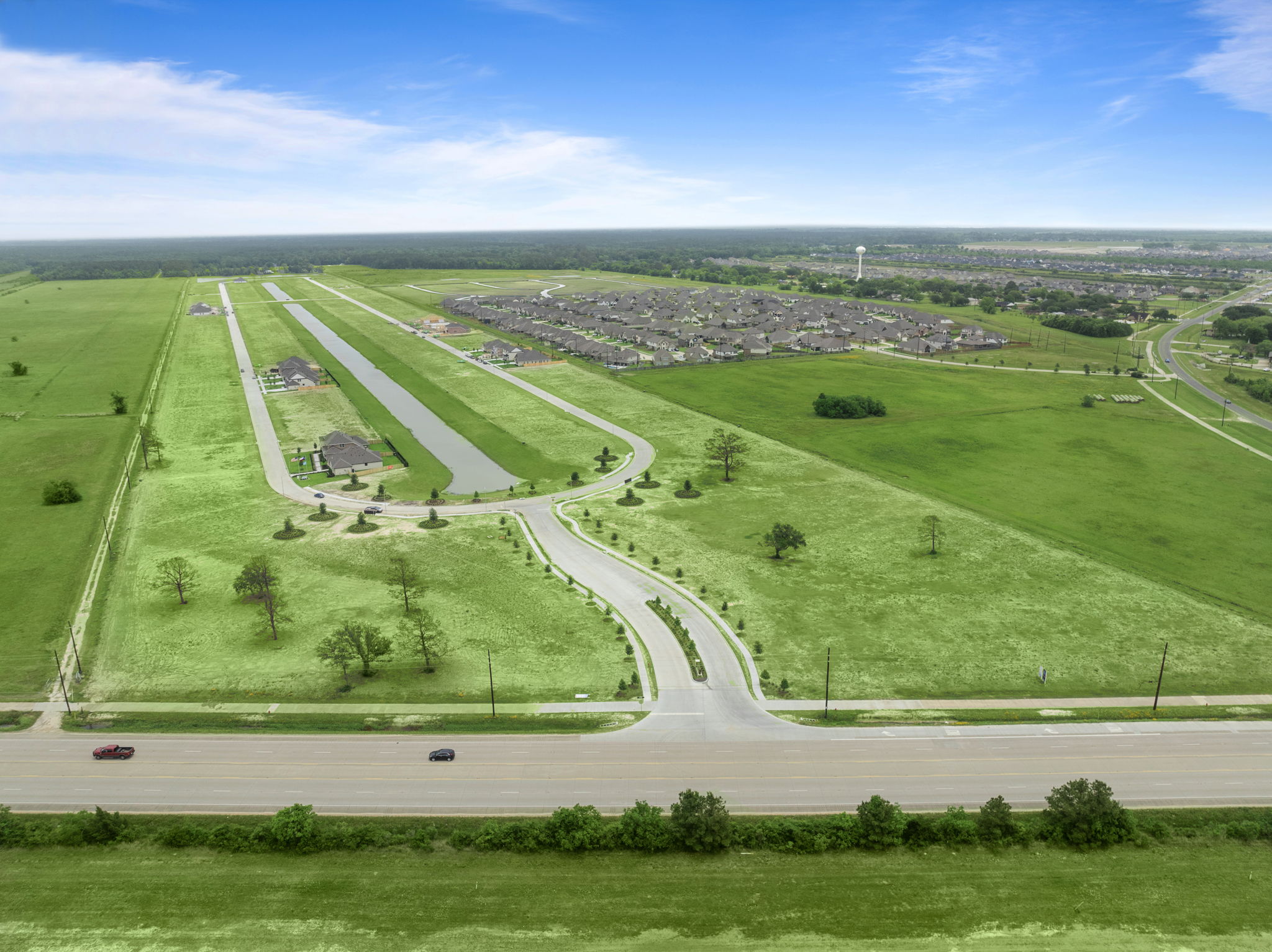 An aerial view of a road and fields.