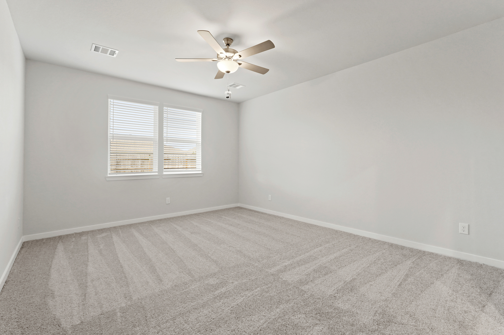 A room with a ceiling fan and a ceiling fan.