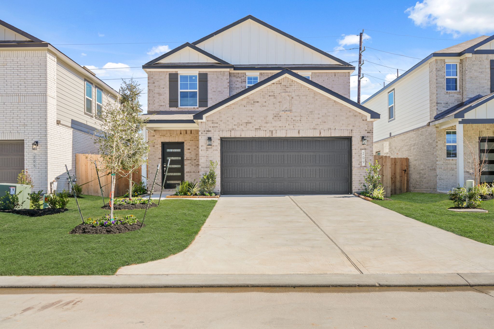 A driveway leading to a house.