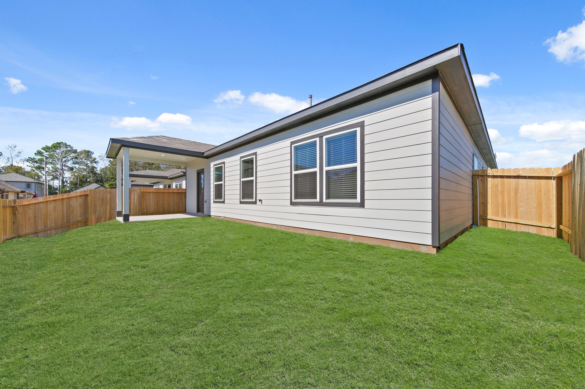 A house with a green lawn.