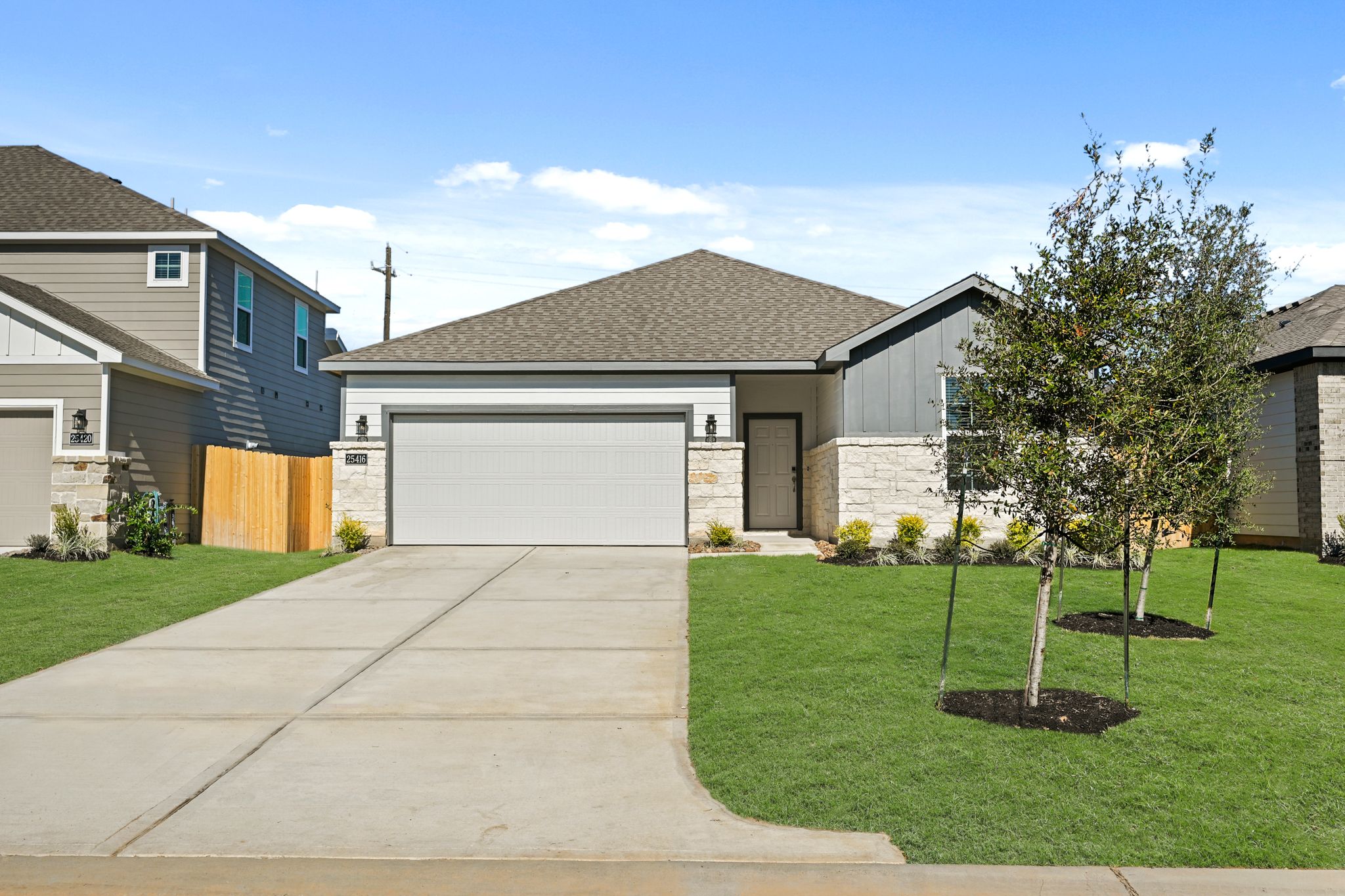 A driveway leading to a house.