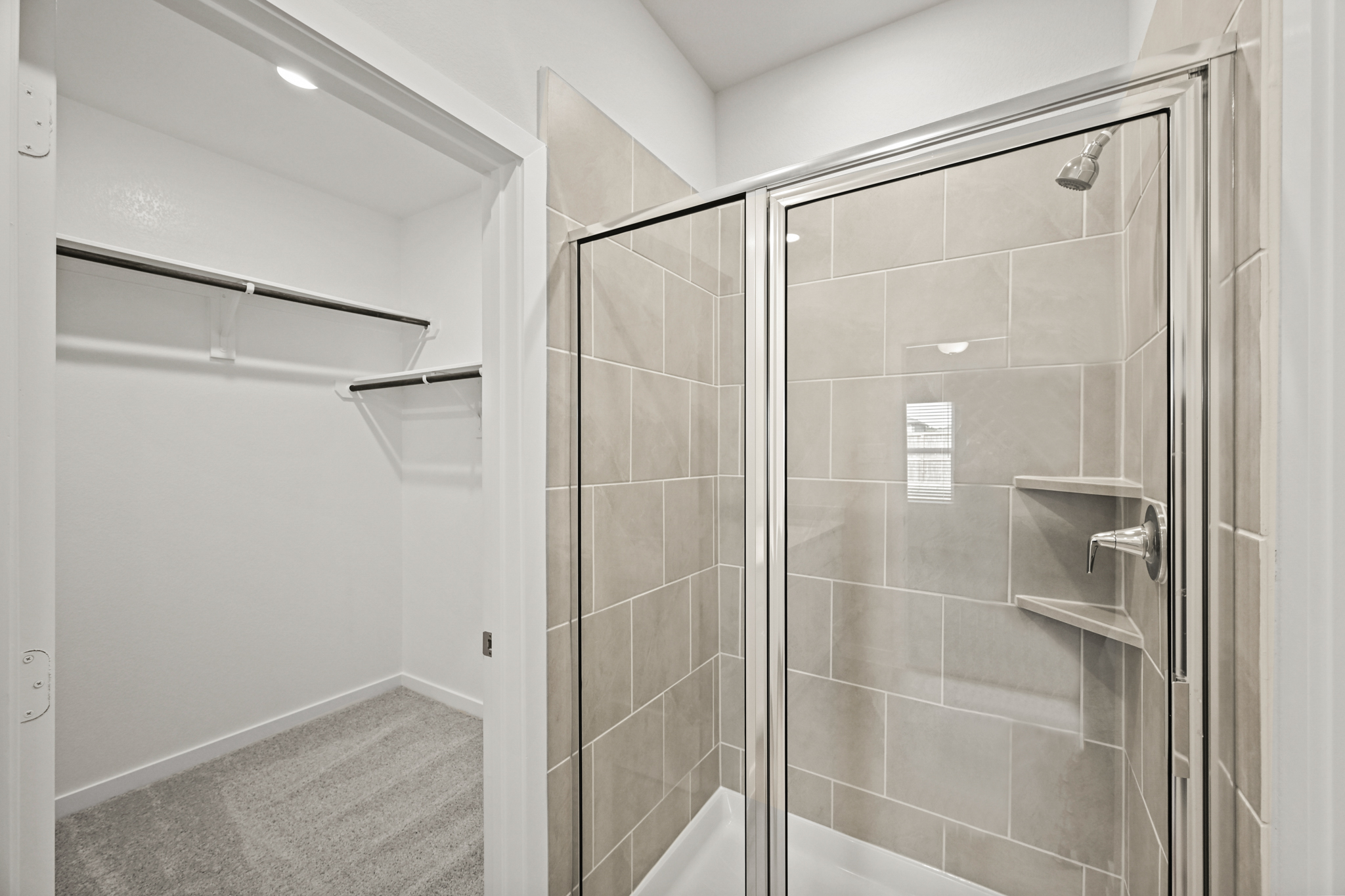 A shower with a glass door.