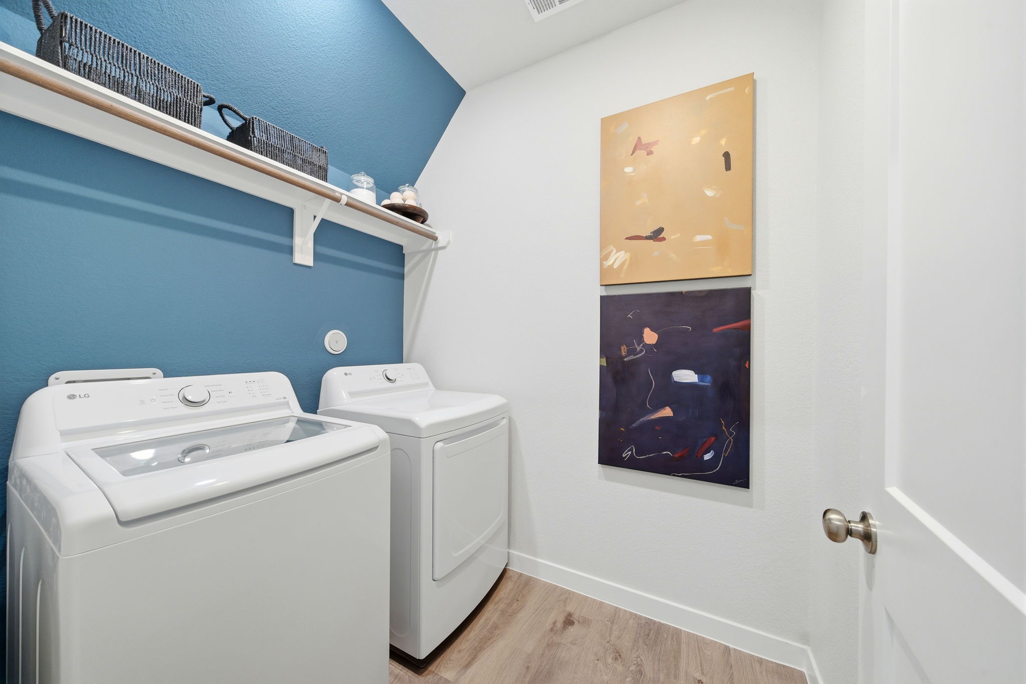 A laundry room with a washer and dryer.