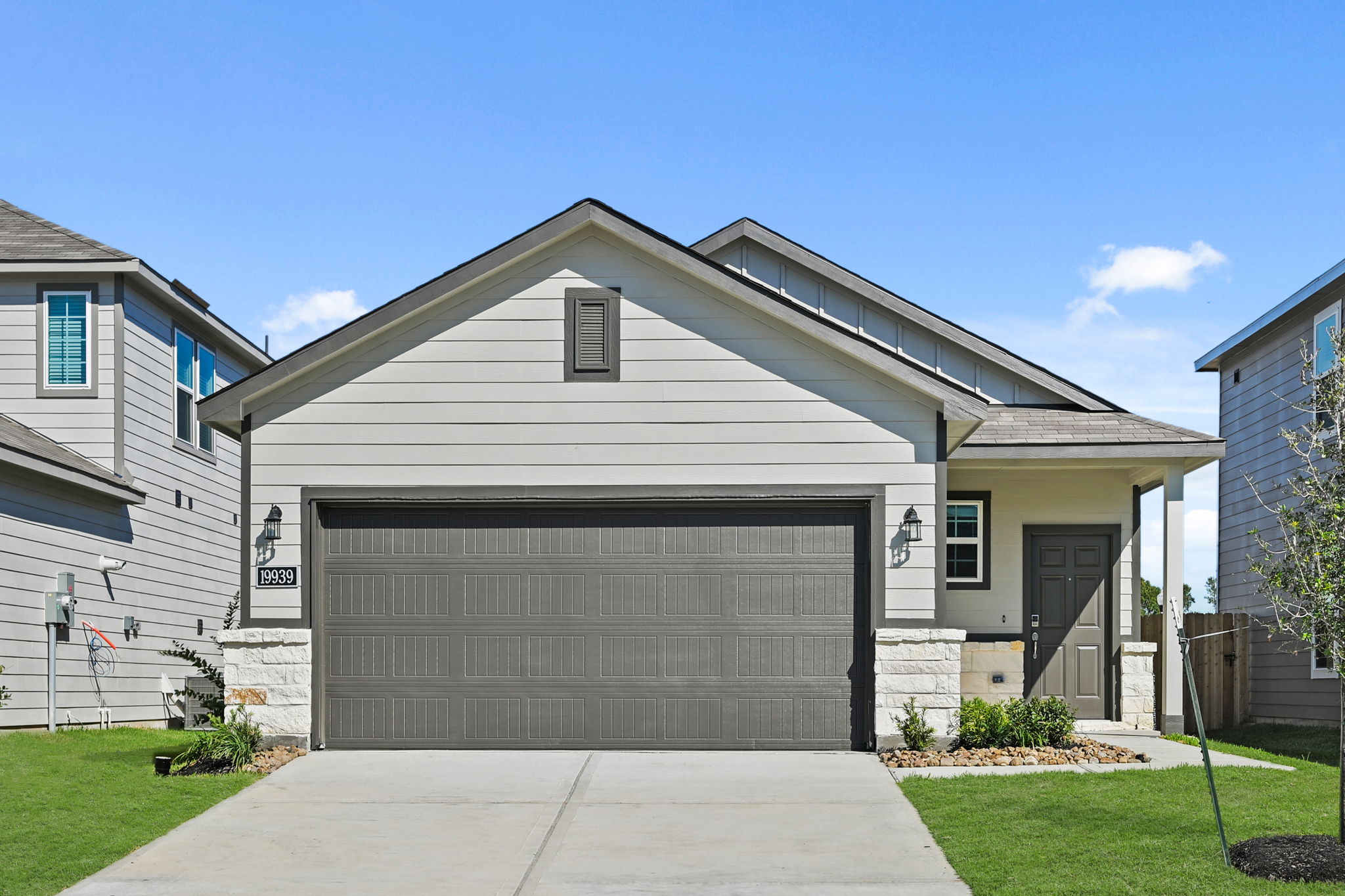 A house with a garage with American Gothic House in the background.