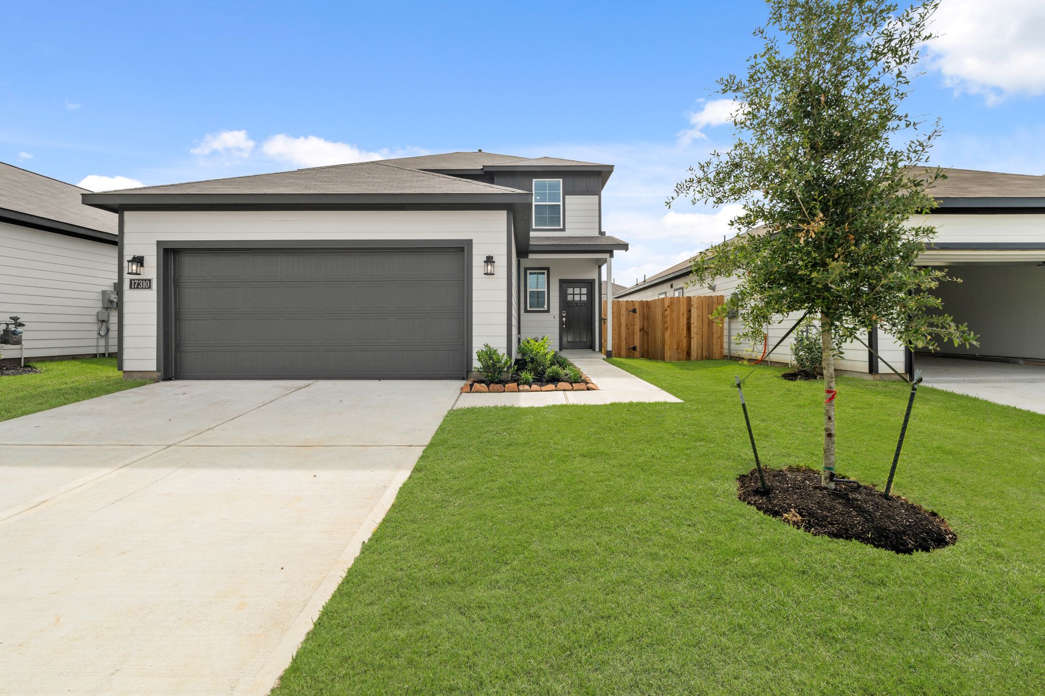 A house with a green lawn.