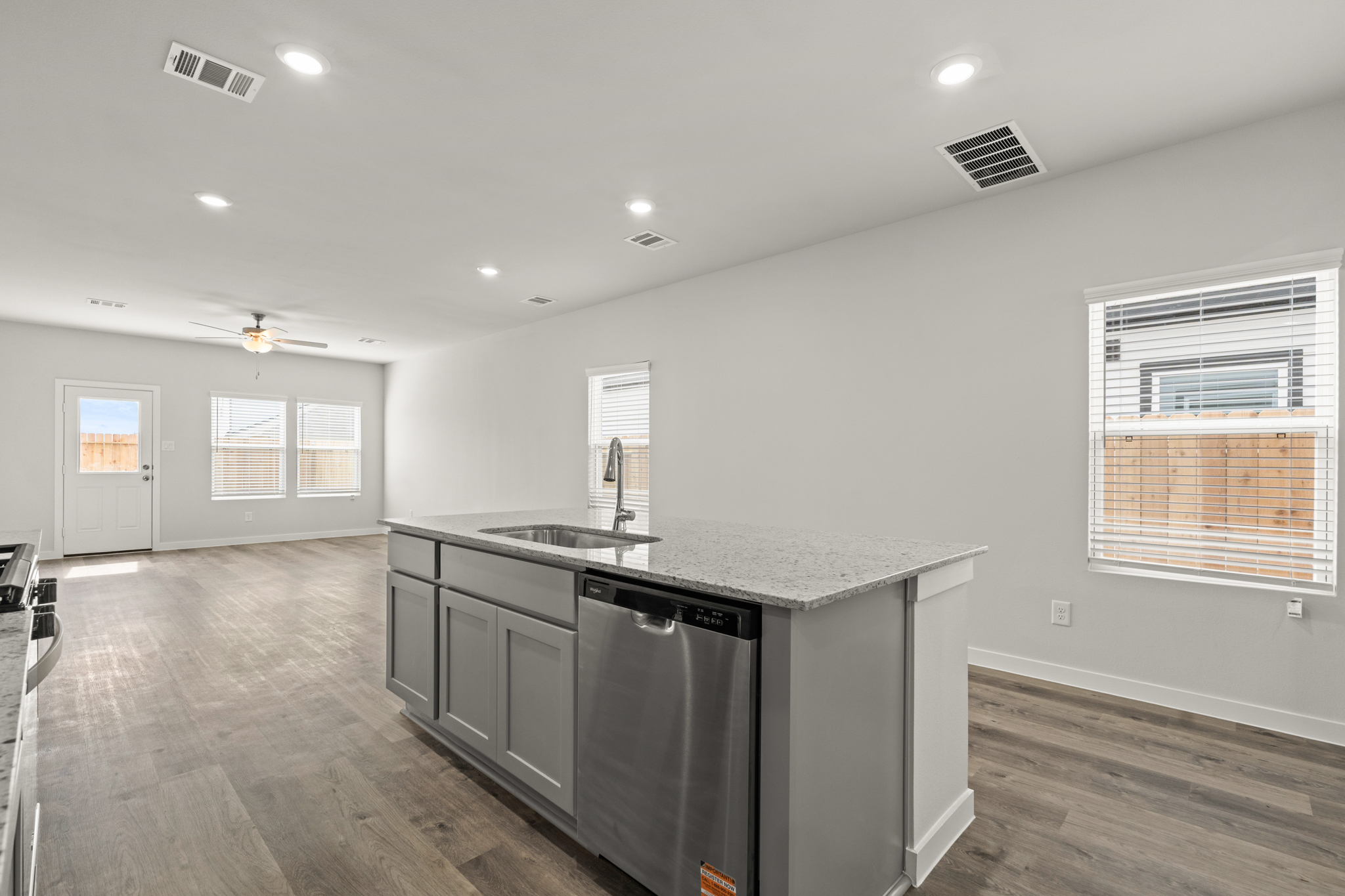 A kitchen with a bar and a sink.