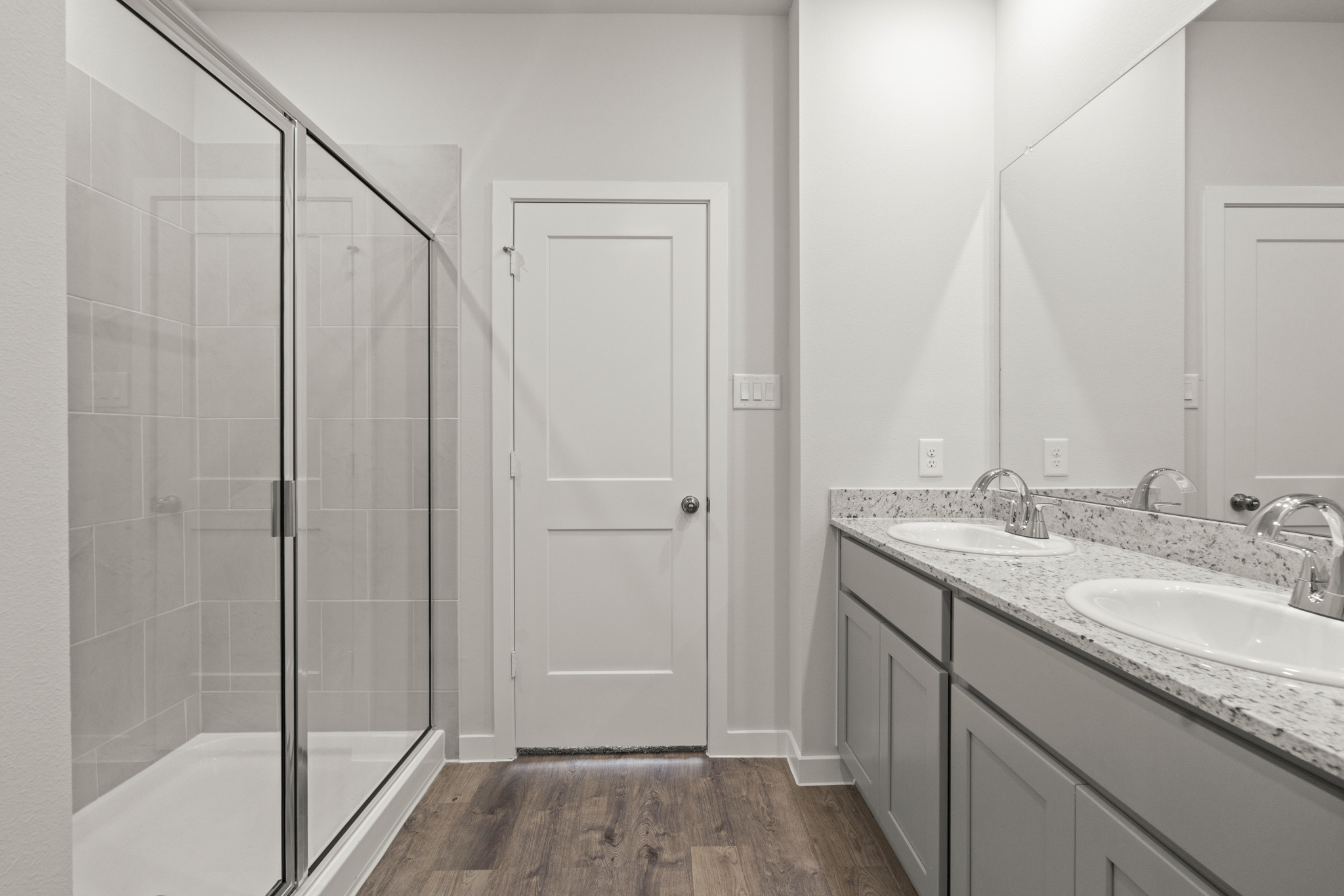A bathroom with a glass shower.