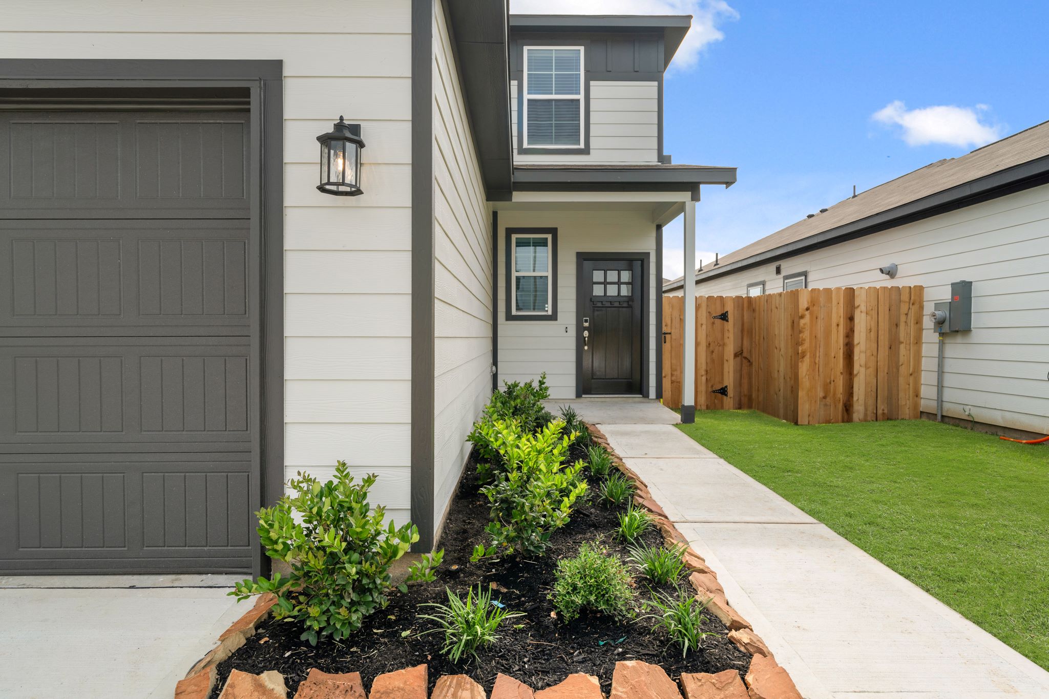 A house with a fence and a yard.