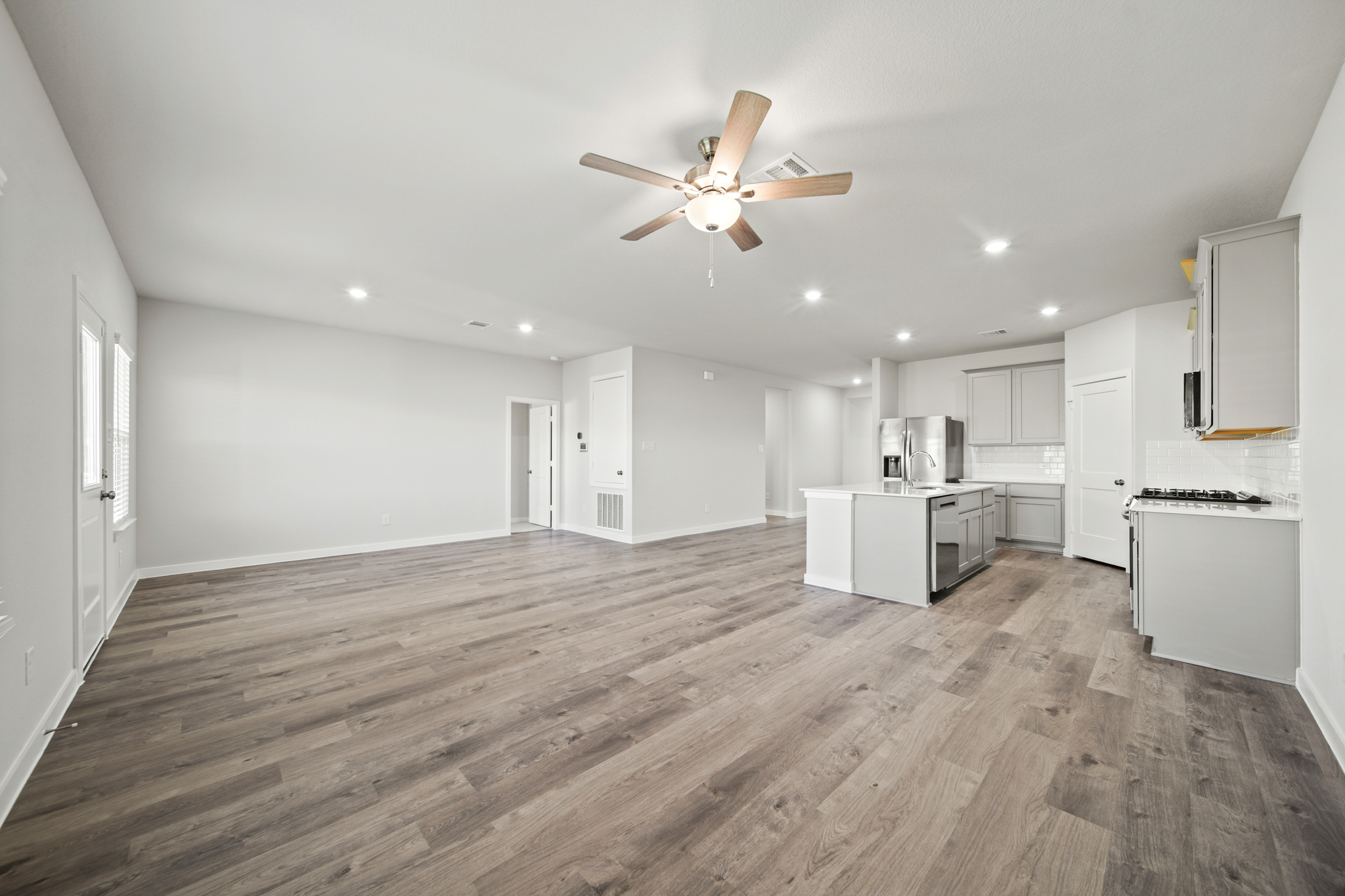 A large kitchen with white cabinets.