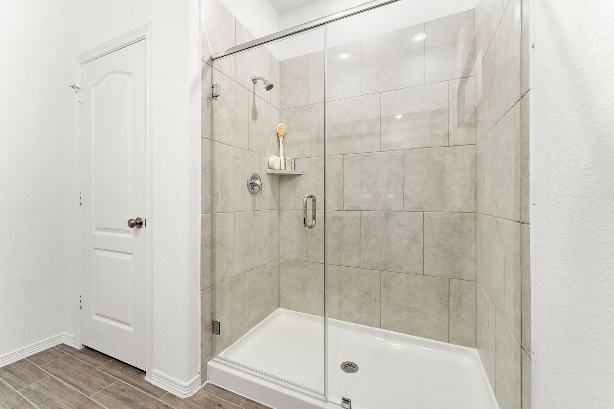 A bathroom with a glass shower.