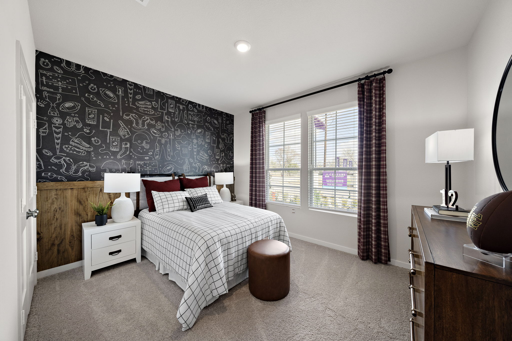 A bedroom with a bed and a window.