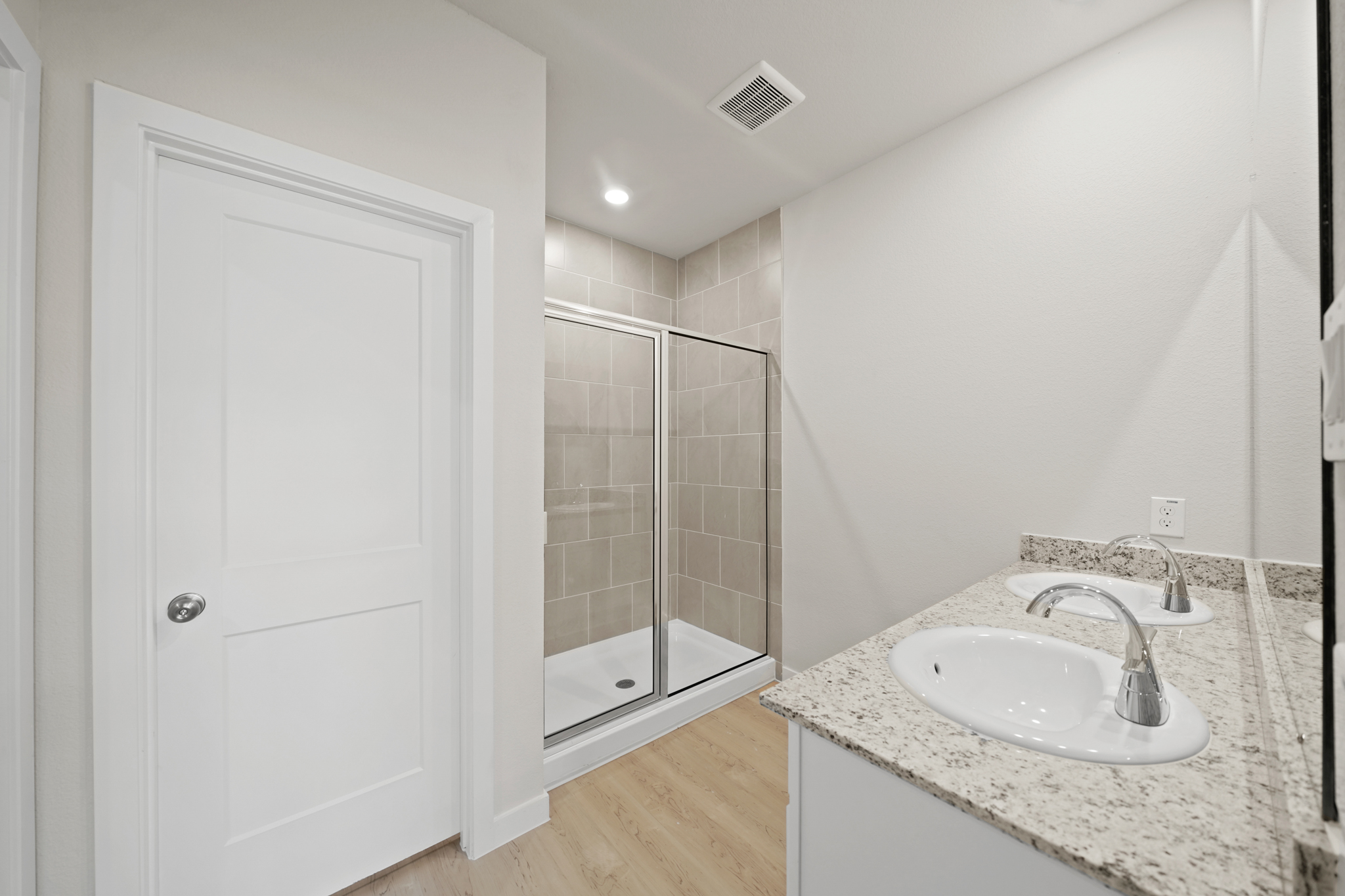 A bathroom with a glass shower.