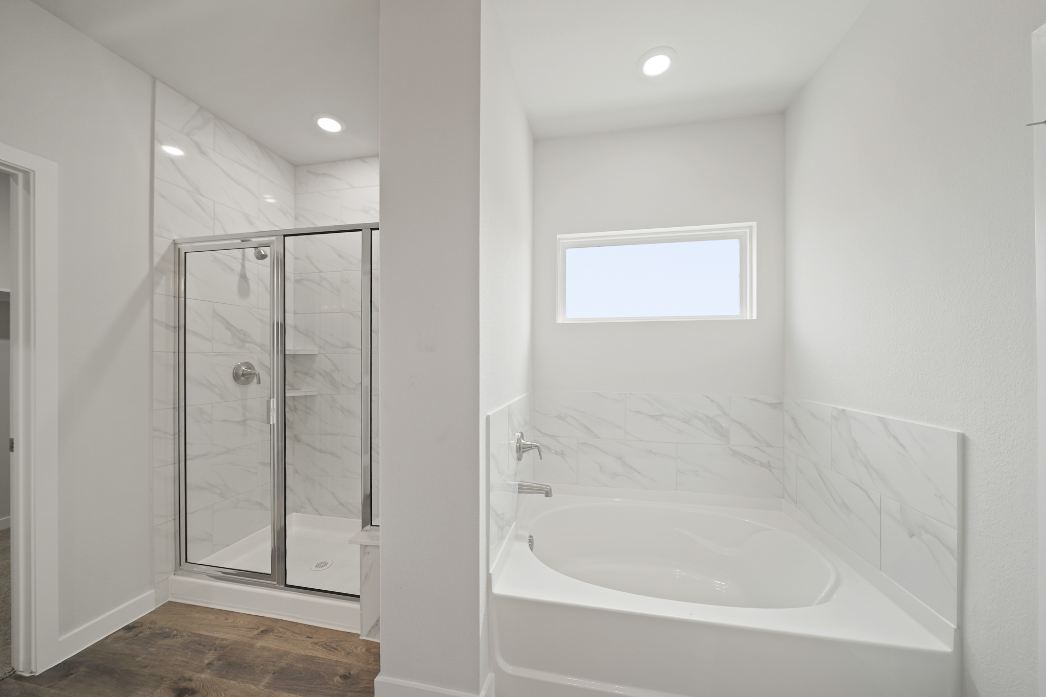 A bathroom with a glass shower.