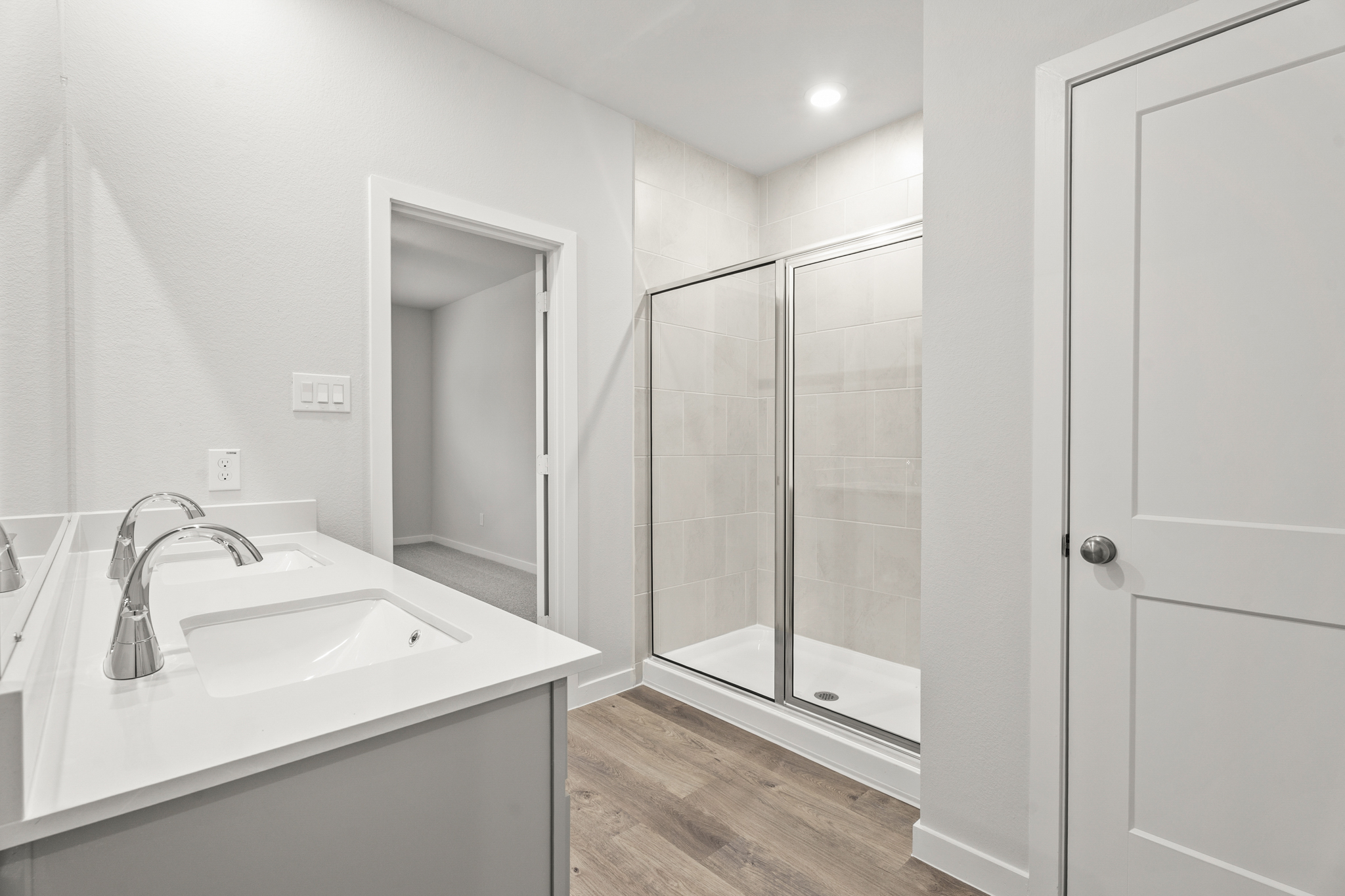 A bathroom with a glass shower.