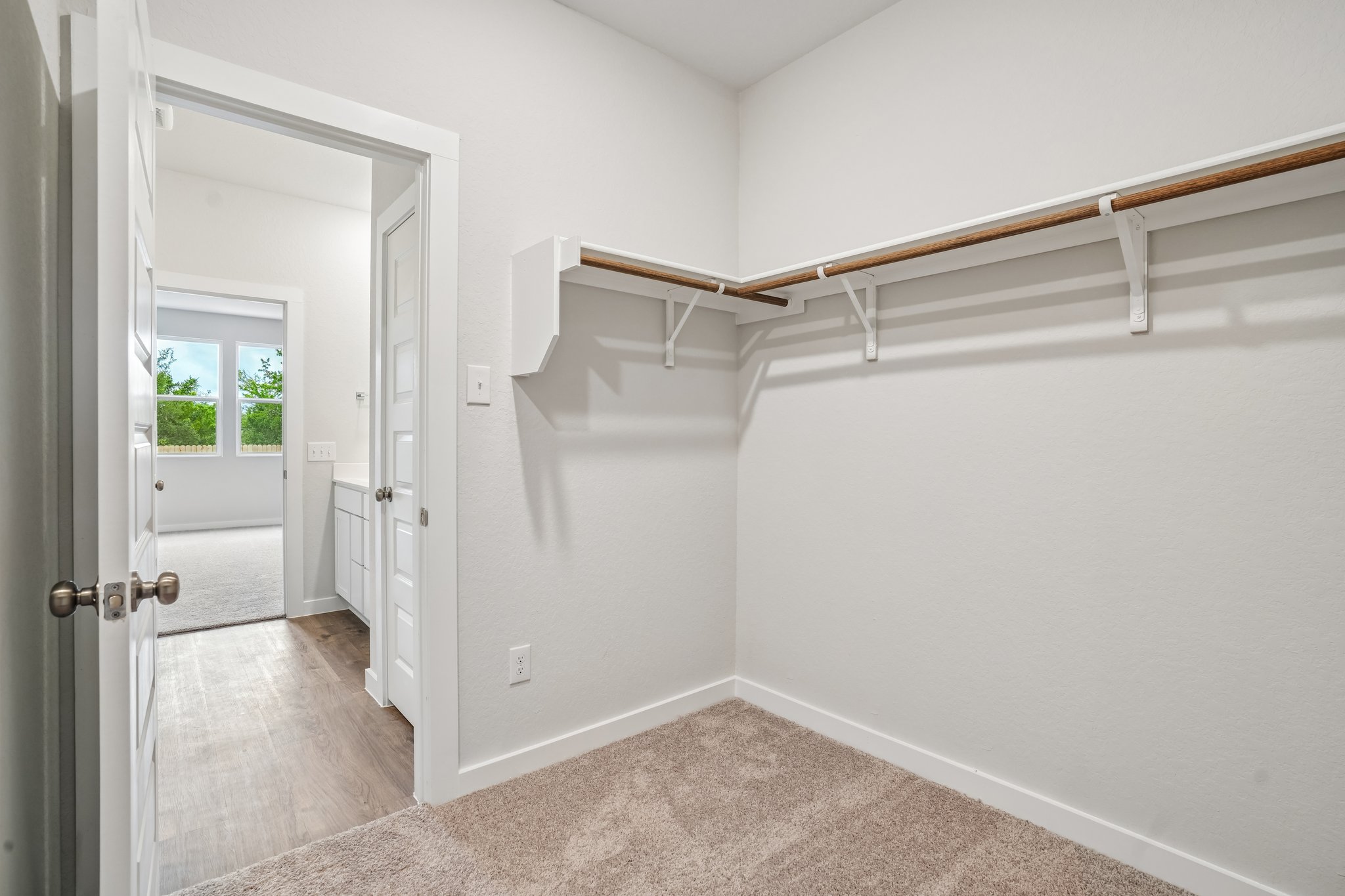 A hallway with white walls.