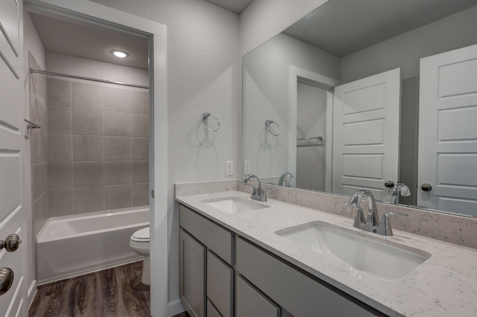 A bathroom with a sink and a bathtub.