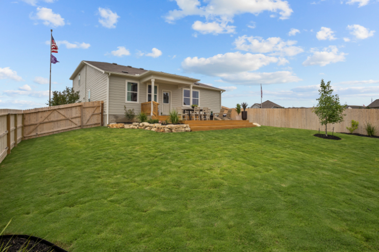 A house with a large lawn.