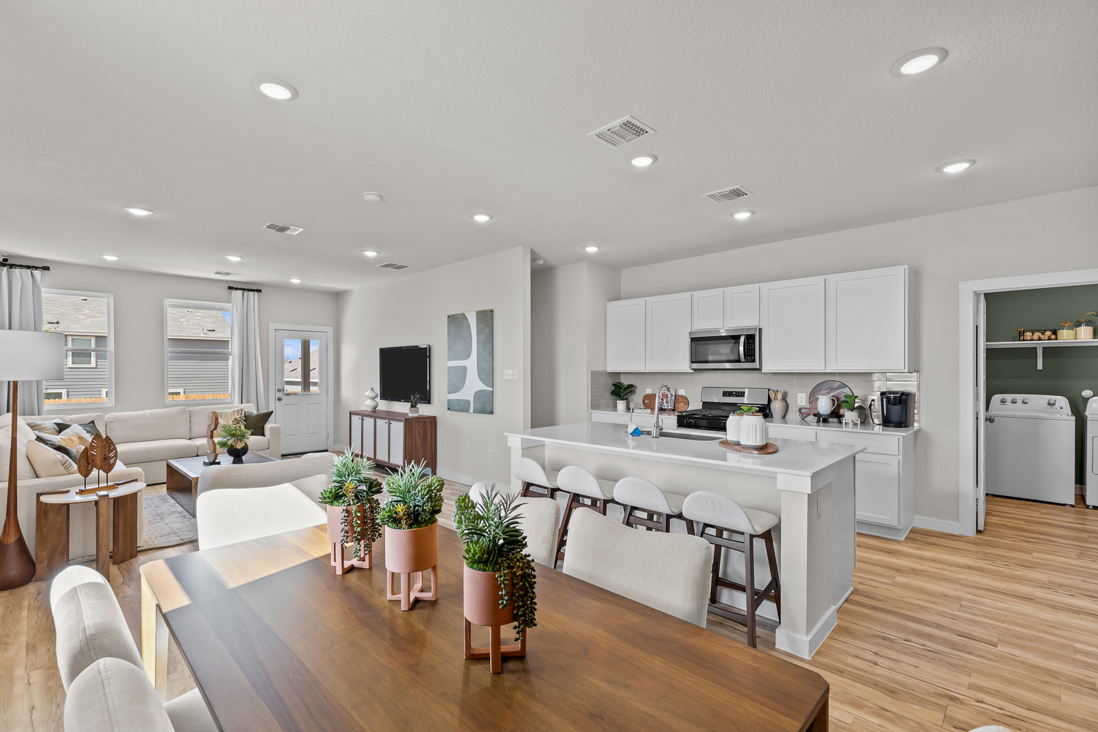 A large kitchen with white cabinets.