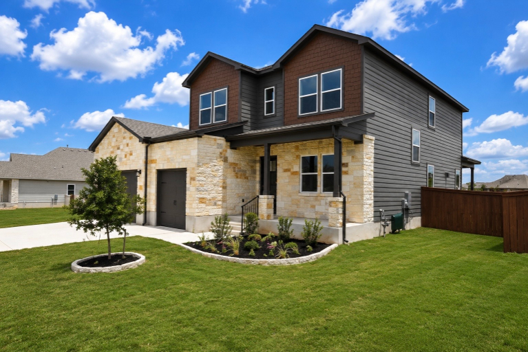 A house with a yard and a fence.