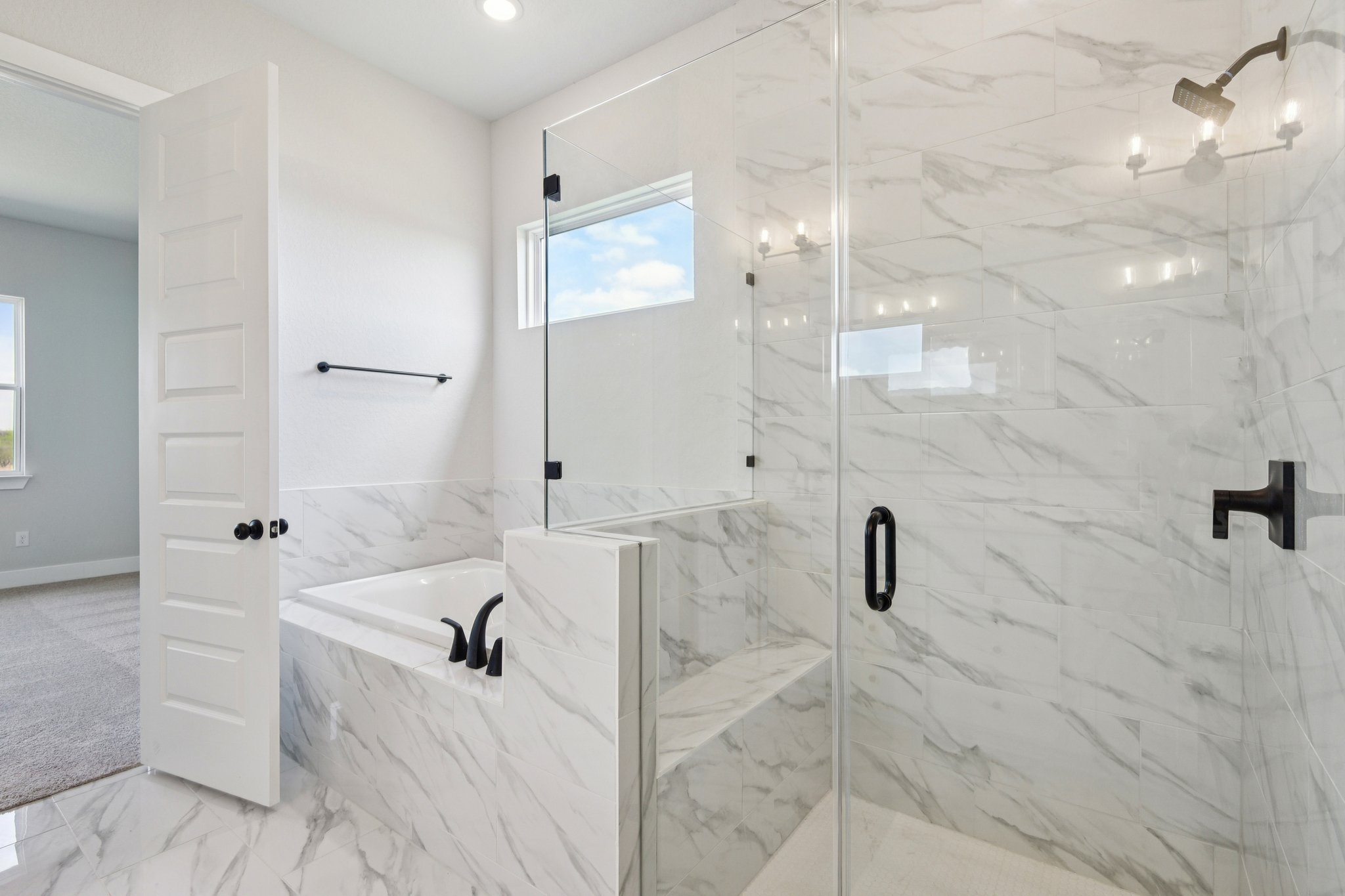 A bathroom with a glass shower.