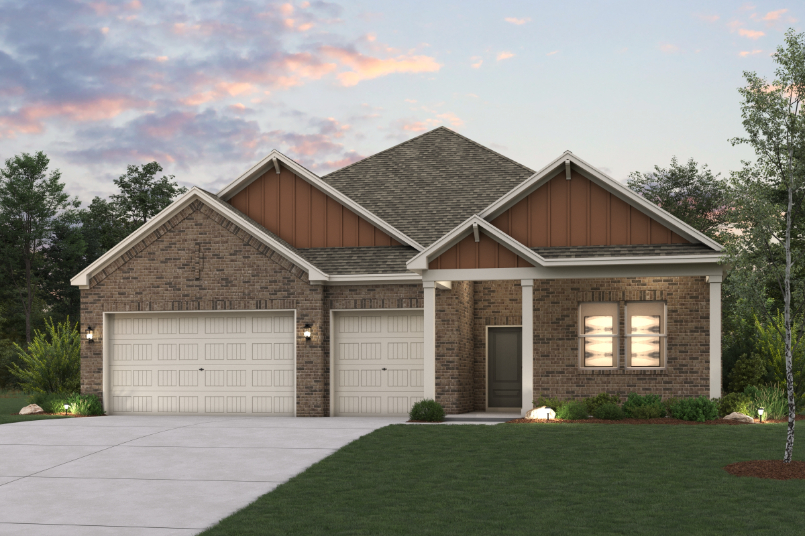 A house with garages and a lawn.