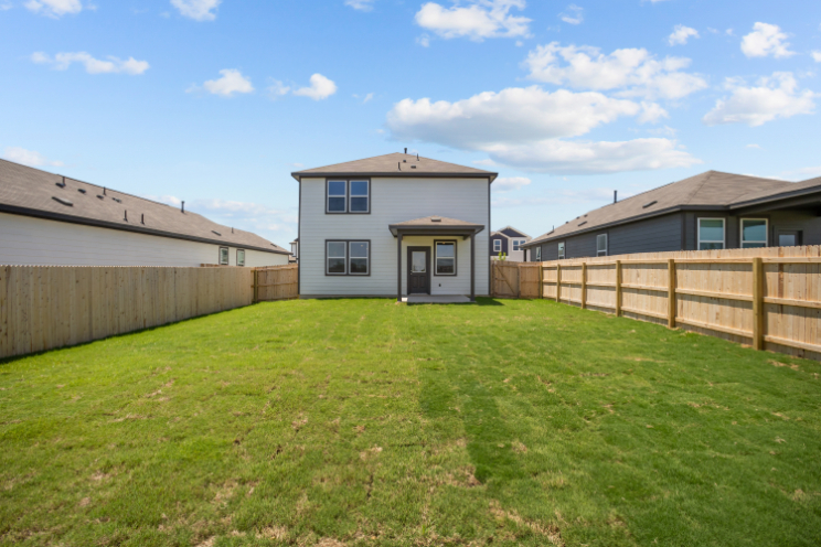 A house with a fence around it.