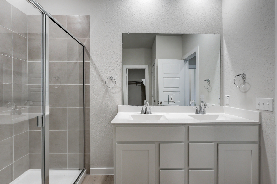 A bathroom with a glass shower.