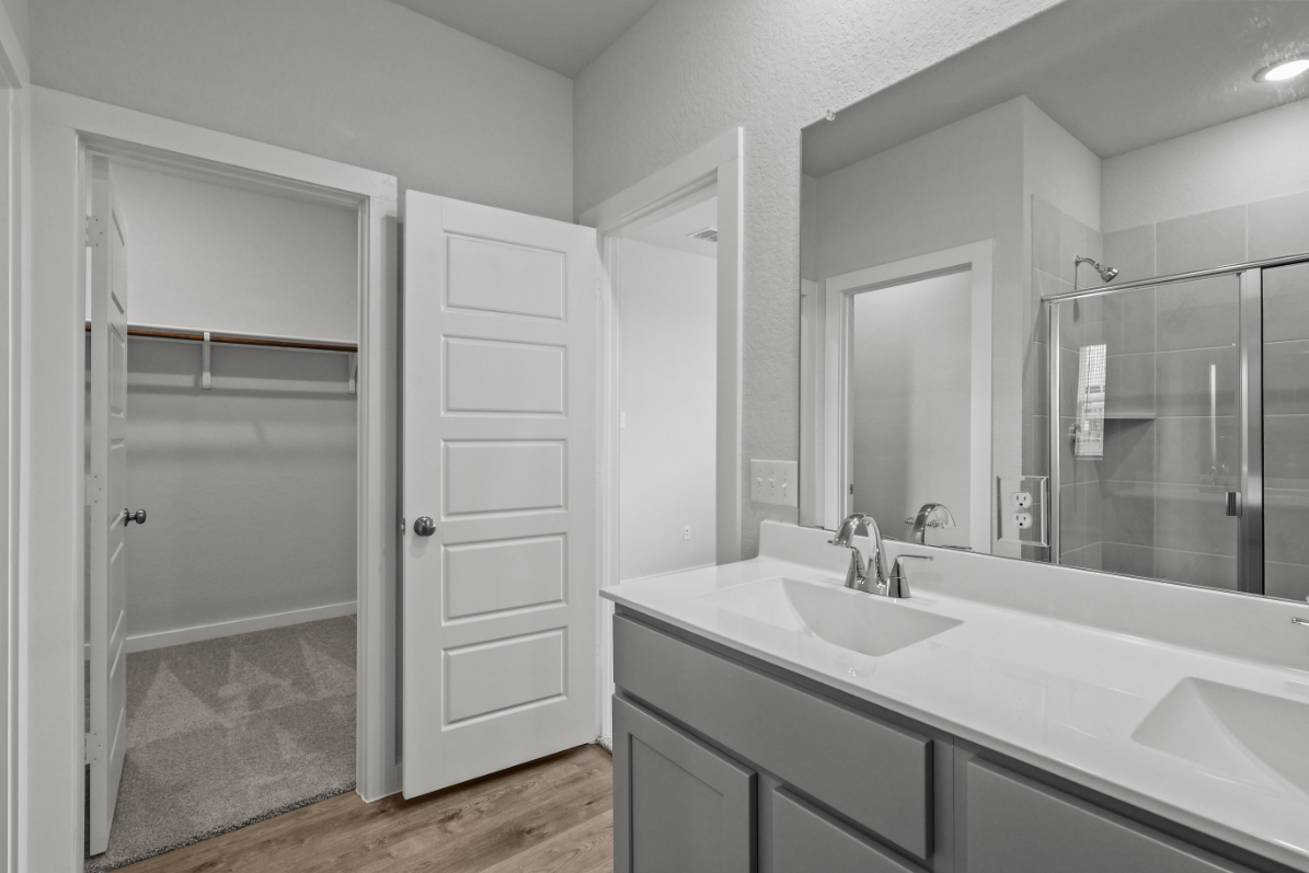 A bathroom with a glass shower.