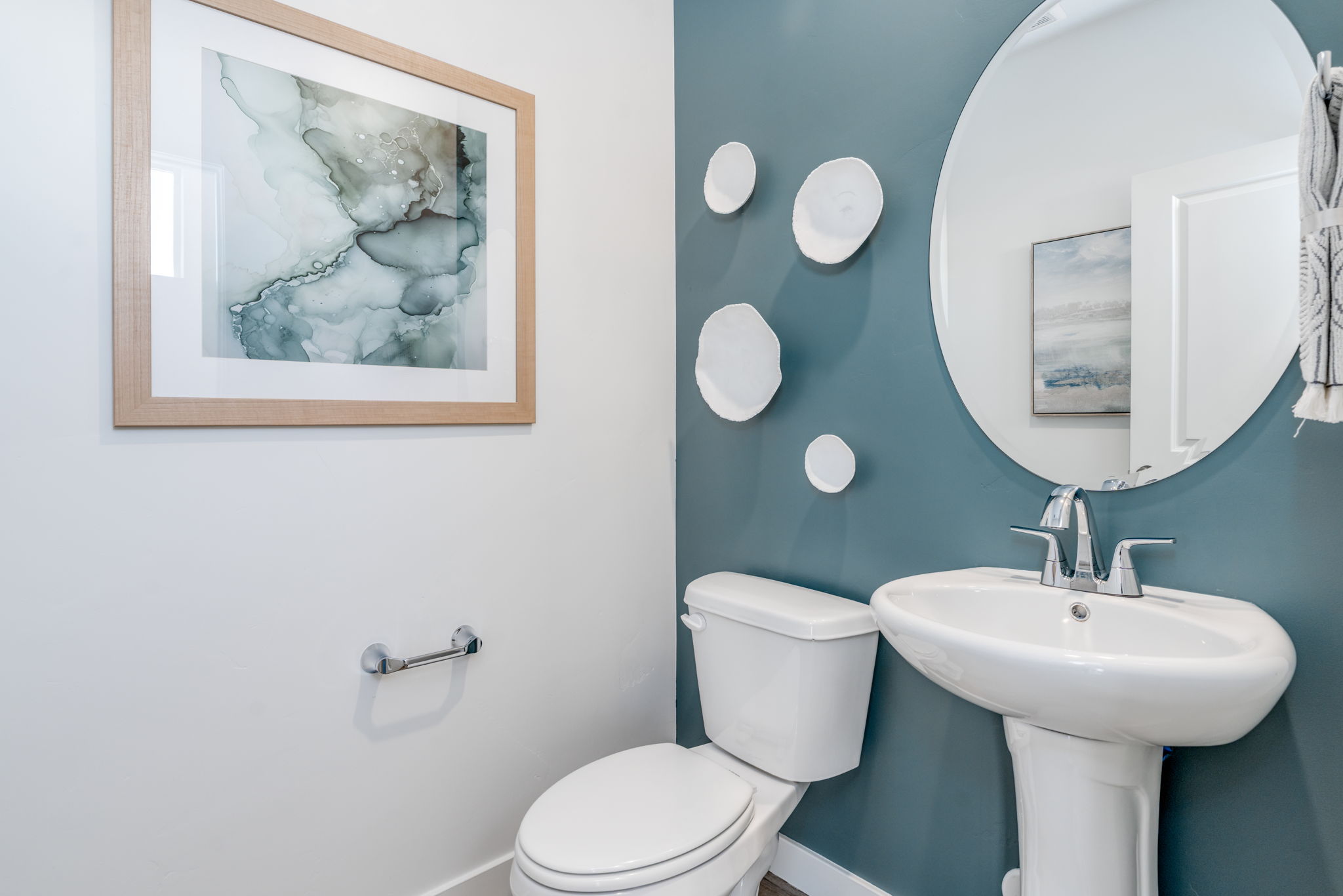 A bathroom with a toilet and a sink.