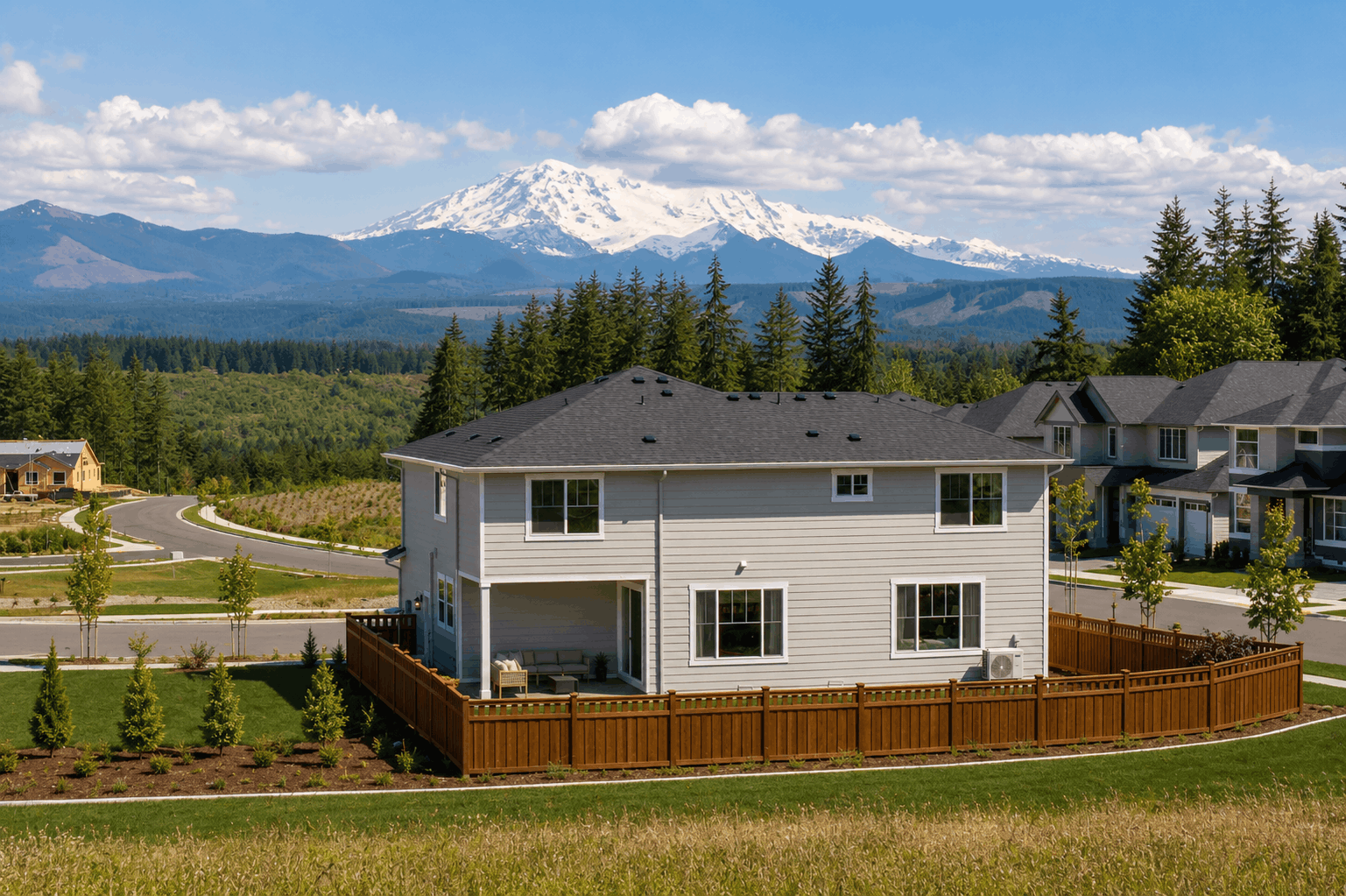 A house with a mountain in the background.