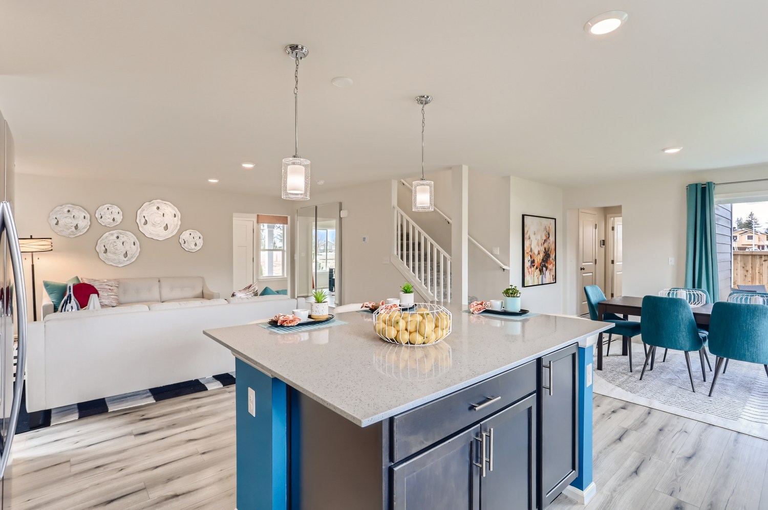A kitchen with a bar and a dining table.