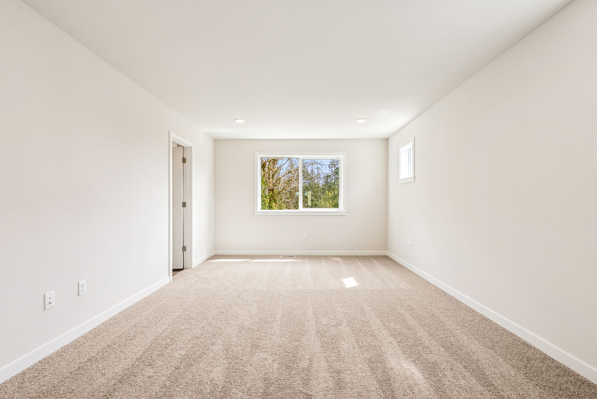 A room with a window and a door.