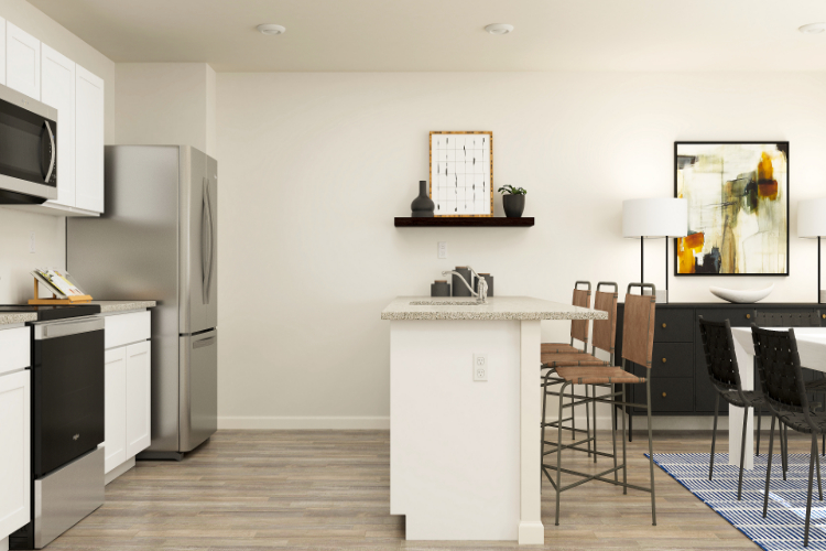 A kitchen with a table and chairs.