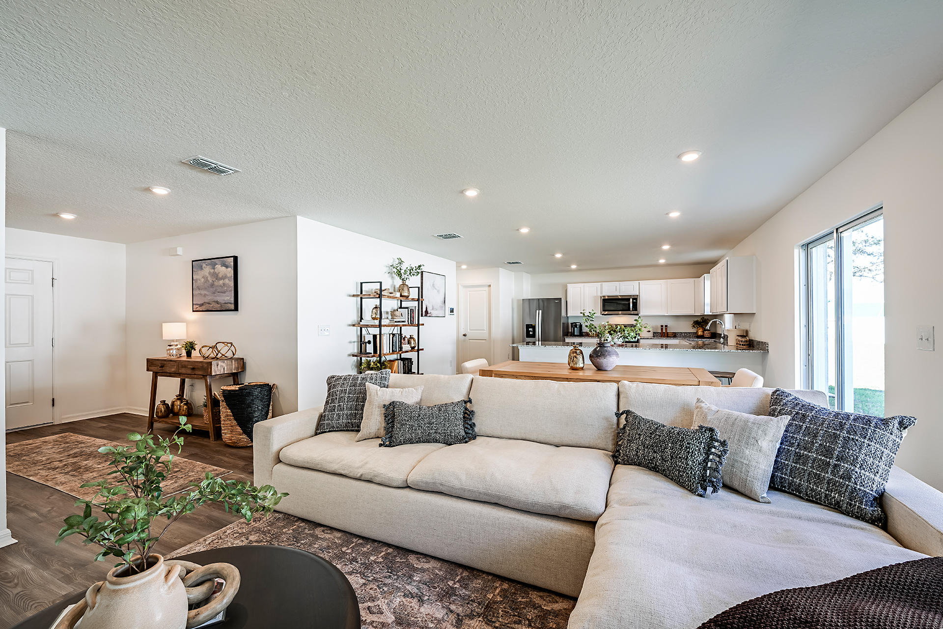 A living room with a couch and a table.