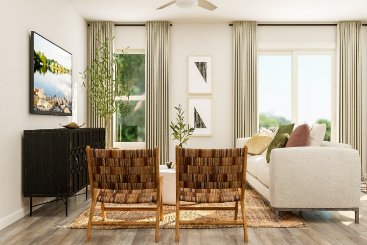 A living room with a couch and chairs.