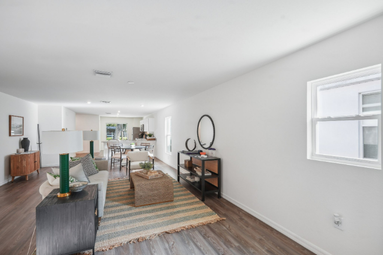 A living room with a large window.