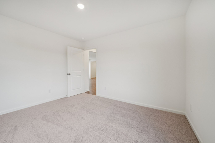A hallway with white doors.