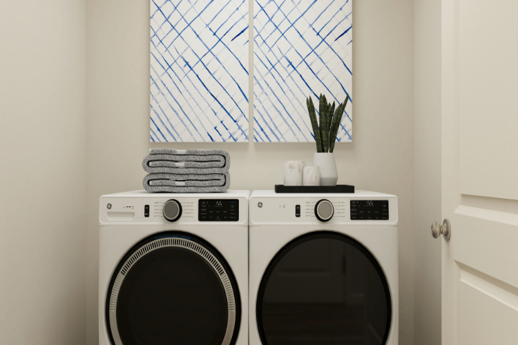 A washing machine in a room.