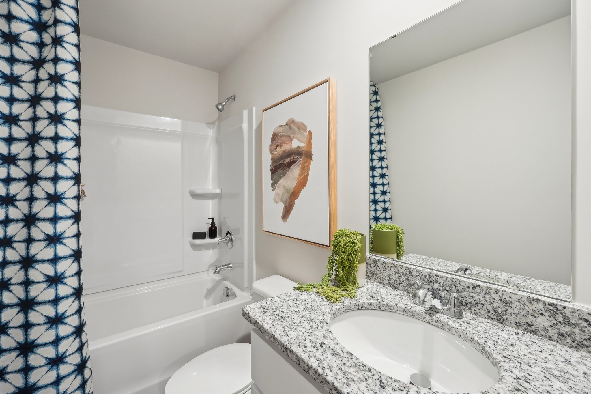 A bathroom with a sink and a bathtub.