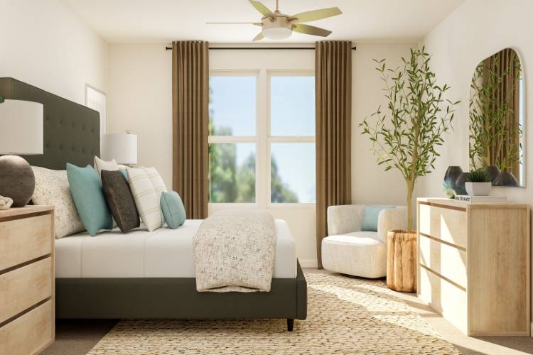 A living room with a couch and a fan.