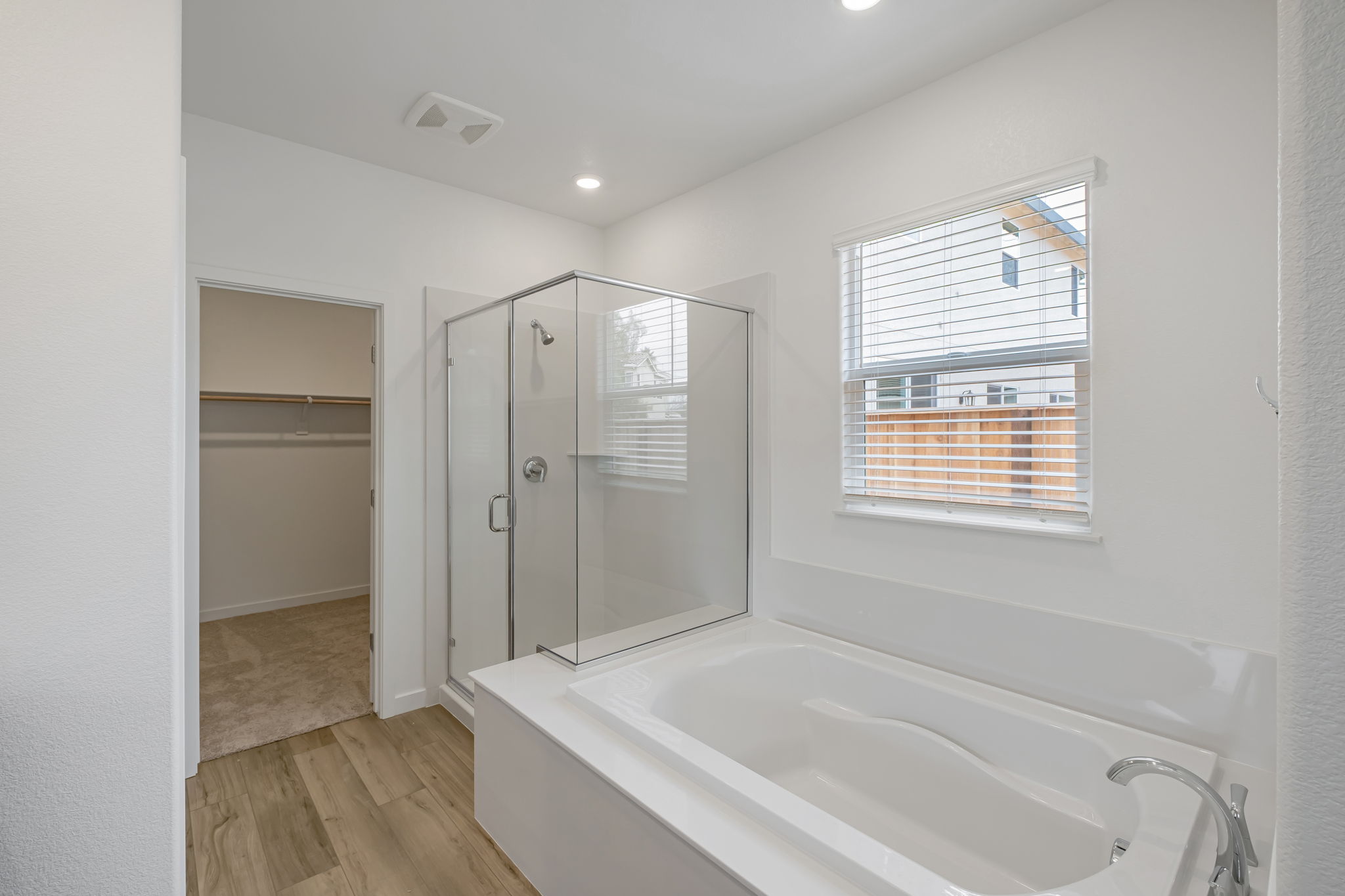 A bathroom with a tub and shower.